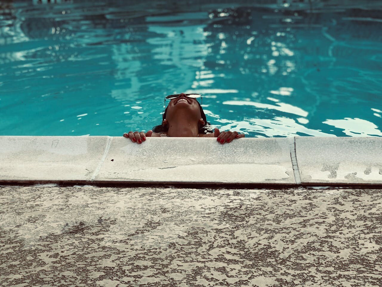 joyful woman in a pool